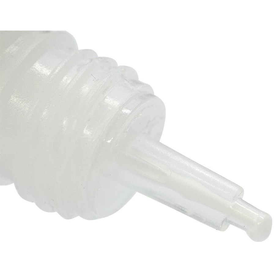 Close-up of the precision applicator tip of a Nuvo Deluxe Adhesive glue bottle.