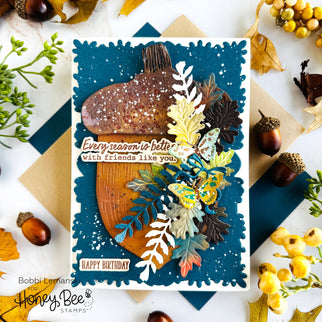 Handmade autumn birthday card featuring an acorn, fall leaves, and butterflies on blue cardstock.