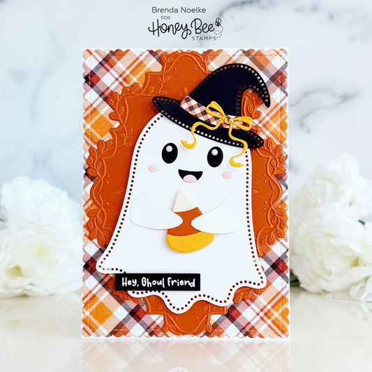 Handmade Halloween card featuring a cute ghost with a witch hat holding a candy corn.