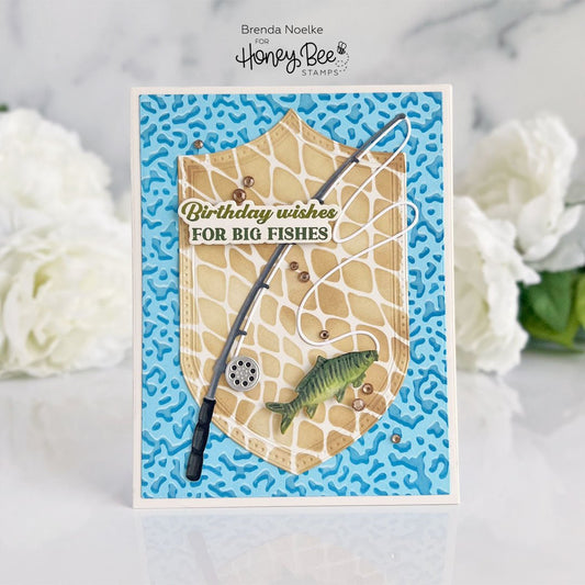 Handmade fishing-themed birthday card with a fishing pole, fish, and 'Birthday wishes FOR BIG FISHES' text.