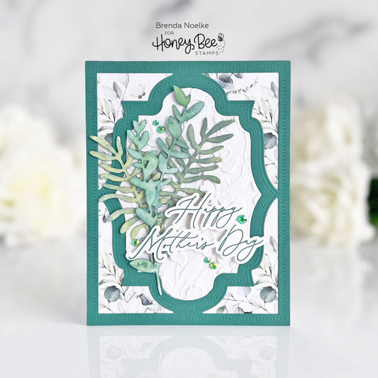 Handmade Happy Mother's Day card with teal botanical dies and embossed white background