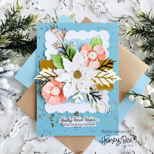 Handmade holiday card with 3D floral die cuts and 'Sending Warm Wishes' sentiment.