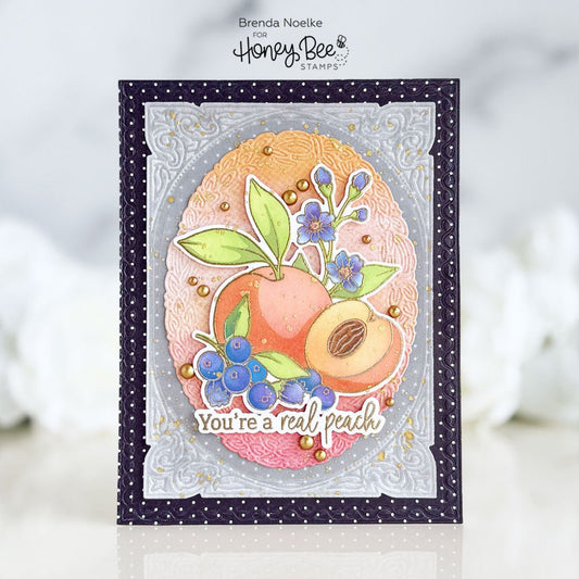 Handmade card featuring peach and blueberry illustrations with the text 'You're a real peach'.