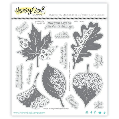 Honey Bee Stamps 'Buzzworthy Stamps, Dies and Paper Craft Supplies' first kit sheet featuring six different leaf-shaped stamp designs in gray and white, with various engraved words and phrases on a white background.