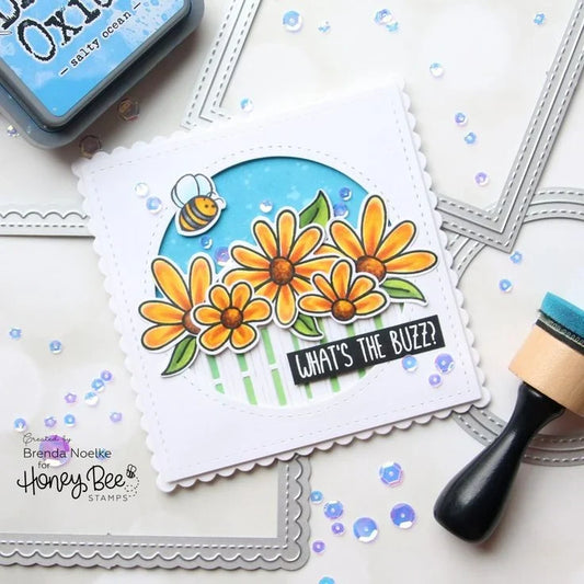 Handmade card featuring yellow flowers, a bee, and 'What's the Buzz?' text by Honey Bee Stamps.