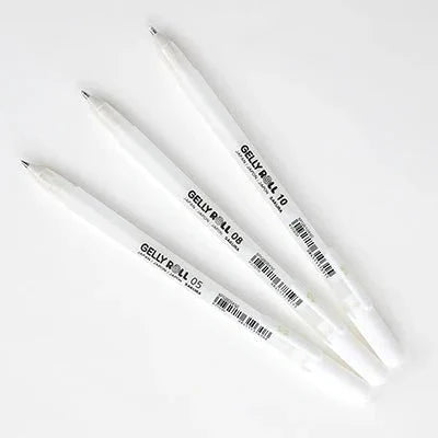 Three Sakura Gelly Roll white gel pens in sizes 05, 08, and 10 on a white background.